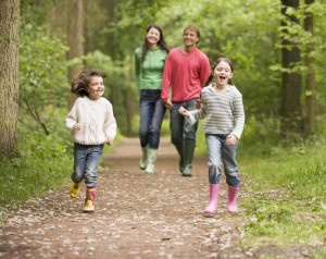 family-walking-through-the-woods